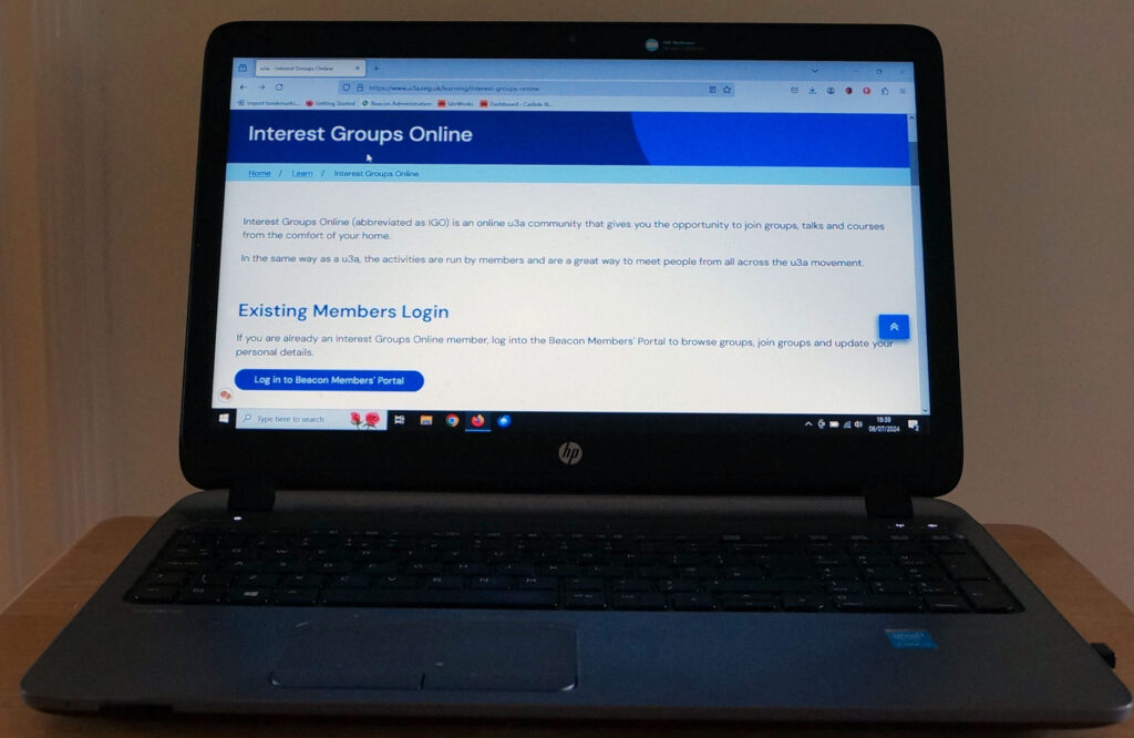 Laptop showing home page of Interst groups online.